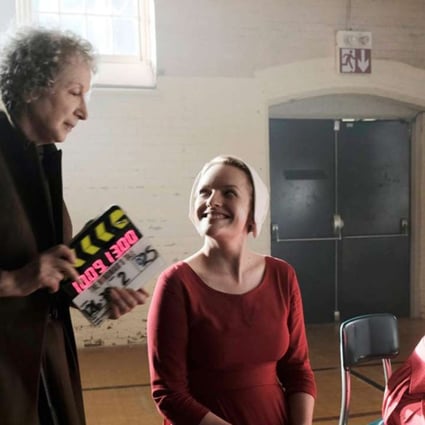 Margaret Atwood (left) was consulted on, and has a cameo role in Hulu's adaptation of her novel The Handmaid's Tale, which stars Elisabeth Moss (centre) as “handmaid” Offred. Photo: Hulu