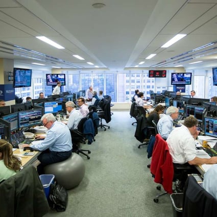 Glass-Steagall regulation, repealed in 1999, would not have prevented or ameliorated the global systemic collapse in 2008. Traders work on the Mizuho Americas trading floor in New York. Photo: Bloomberg