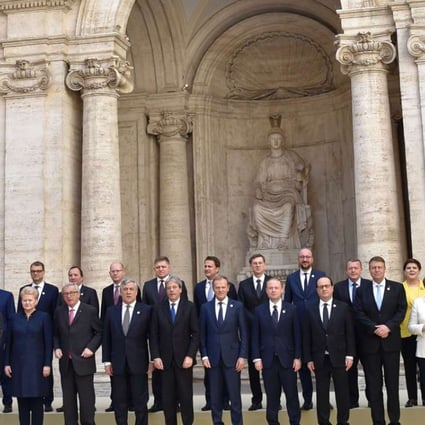 Chancellor Angela Merkel of Germany (in white jacket) poses with European Union leaders during a special summit to mark the 60th anniversary of the bloc's founding agreement, the Treaty of Rome, at the Capitoline Hill in Rome on March 25. Photo: AFP