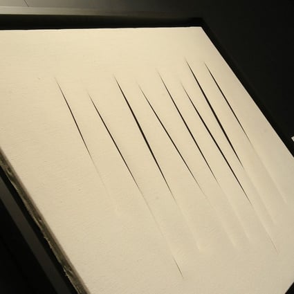 Concetto spaziale, Attese by Lucio Fontana is seen at the Christie's spring 2012 press preview of overseas auction highlights at Hong Kong Convention & Exhibition Centre in Wan Chai. Photo: SCMP Picture