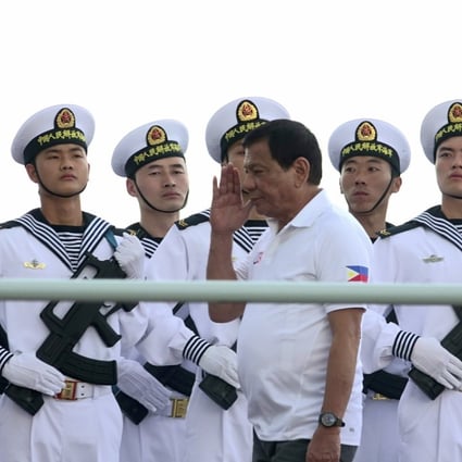 PLA Navy personnel are saluted by Philippines President Rodrigo Duterte as he tours a Chinese navy flotilla that docked in Davao City on a four-day goodwill visit, on May 1. Photo: EPA