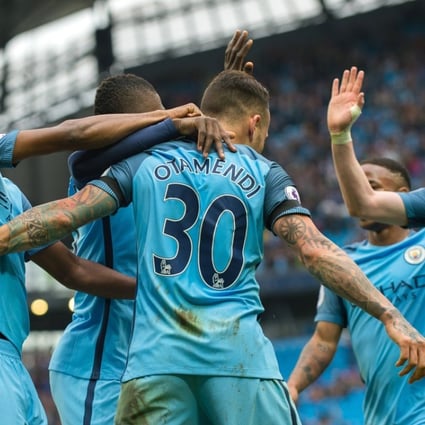Manchester City's Nicolas Otamendi (centre) is congratulated by his teammates after scoring his team’s fifth goal against Crystal Palace. Photo: EPA