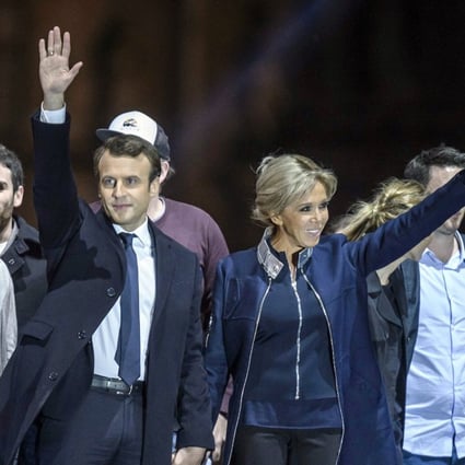 Emmanuel Macron and his wife Brigitte Trogneux celebrate his election victory. Photo: EPA
