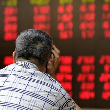 An investor looks at an electronic board showing stock information at a brokerage house in Beijing, China, in file photo from June 24, 2016. Photo: Reuters