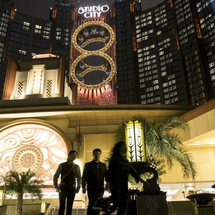 People walk past Studio City casino resort in Macau, developed by Melco Crown Entertainment. Photo: Bloomberg