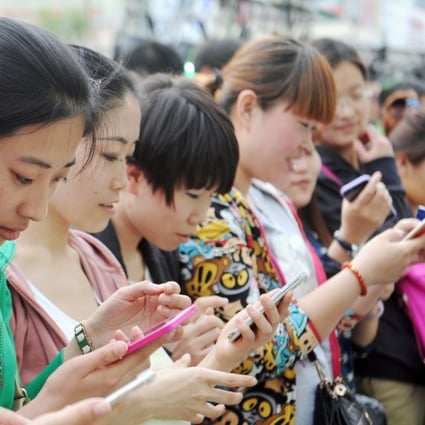 The Chinese on average spend nearly 3 hours a day on their smartphones with social networking tools, watching videos and shopping online. Photo: Imaginechina