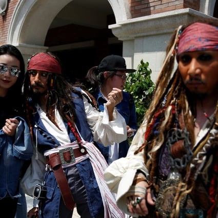 Fans pose for pictures ahead of the global premiere of Pirates of the Caribbean: Dead Men Tell No Tales in Shanghai. Photo: Reuters