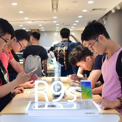 An Oppo experience store in Guangzhou, where users can try out smartphones. Oppo’s R9s shipped 8.9 million units for third place worldwide in the first quarter. Photo: Handout