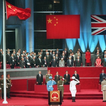 The Union Jack is lowered minutes before midnight on June 30, 1997, during the Hong Kong handover ceremony. Photo: Robert Ng