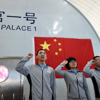 Four volunteers take an oath before starting their stay in the Lunar Palace 1. Photo: Xinhua