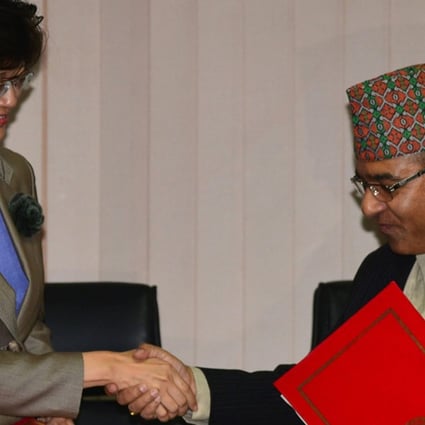 Nepal's Foreign Secretary Shankar Das Bairagi and China's Ambassador to Nepal, Yu Hong (L), exchange documents during a signing ceremony relating to the One Belt One Road initiative in Kathmandu. Photo: AFP