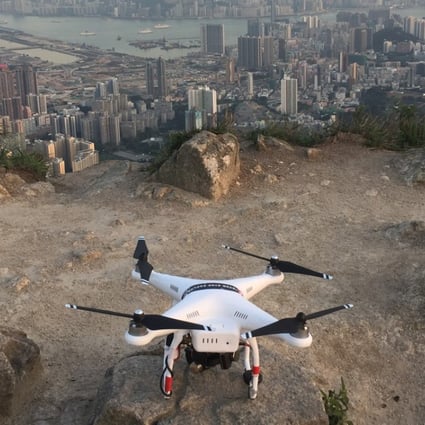 A DJI Phantom 2 drone, ready for lift off, overlooking Kowloon in Hong Kong. Some of its larger commercial models can cost in excess of US$100,000. Photo: Edwin Lee