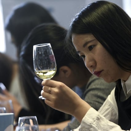 Chinese students taste and study wine. Photo: AFP