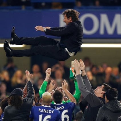 Chelsea players celebrate their title win with manager Antonio Conte after the 4-3 win over Watford. Photo: Reuters