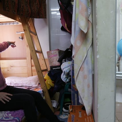 Ms Wu, pictured, and her husband and daughter escaped through a back door hidden behind their bed. They had never opened the door in the 11 years they had lived there, and did not even know if it opened. Photo: Dickson Lee