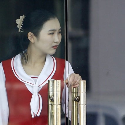 A North Korean waitress at a restaurant in Dandong, China. North Korean restaurants overseas are a vital source of foreign money for Pyongyang. Photo: AFP
