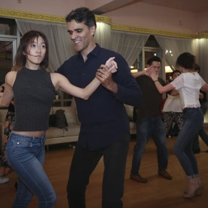 Dance teachers Sherman Mosquito (left) and Ricci Yasin (right) at a salsa dance party in Causeway Bay. Photo: Edmond So