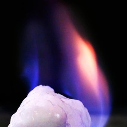 A burning chunk of methane hydrate, or ‘flammable ice.’ China has successfully tested a production system to extract the methane gas and convert it to natural gas on a rig at sea. Photo: Alamy