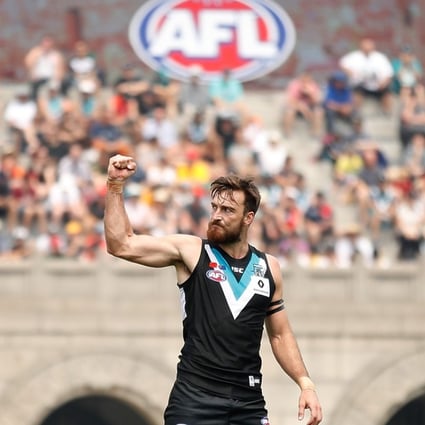 Port Adelaide’s Charlie Dixon celebrates a goal as AFL makes it official debut in China. Photos: AFL Media