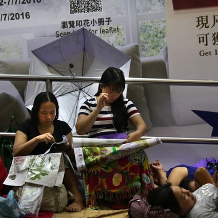 Domestic workers meet in Central on a day off in June last year. Photo: AFP