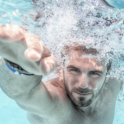 Man swimming in a pool. Photo: Shutterstock