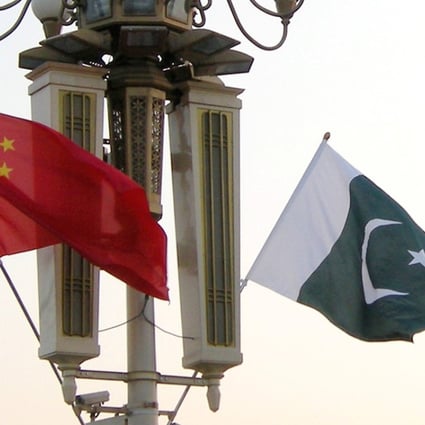 Chinese and Pakistani national flags flutter on a lamp post in Tiananmen Square in Beijing. Photo: ImagineChina