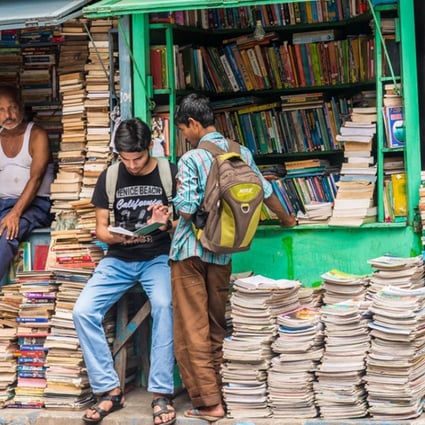 Indian students check out books at an old street stall in Kolkata in West Bengal.