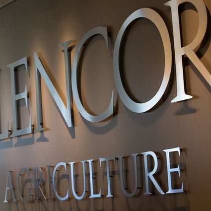 An employee stands by a logo for Glencore Agriculture in Glencore Plc's offices in Rotterdam, Netherlands. The unit is exploring a possible takeover of rivals Bunge. Photo: Bloomberg