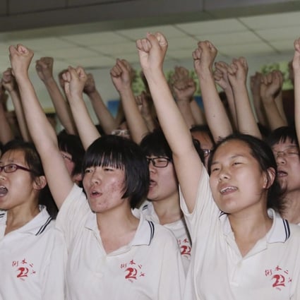 Hengshui No 2 High School pupils in Hengshui, Hebei, cheer during a morale-building event ahead of the university entrance examination in June 2014. Photo: Reuters