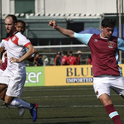Joe Powell from West Ham United (second right) strikes the ball against Yau Yee League Masters at the HKFC CITI Soccer Sevens. Photo: Jonathan Wong