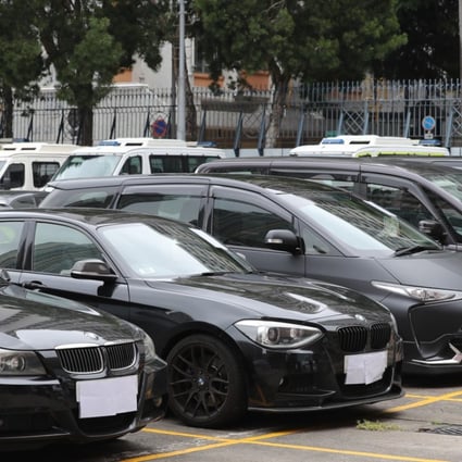 Uber vehicles detained at the Sham Shui Po police station in Sham Shui Po. Hong Kong police arrested 22 Uber drivers in an undercover sting operation, the largest of its kind. Photo: Edward Wong