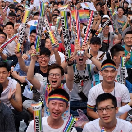 Same-sex activists cheer as they celebrate the landmark decision by the top court in Taipei, paving the way for Taiwan to become the first place in Asia to legalise gay marriage, on May 24. Photo: AFP