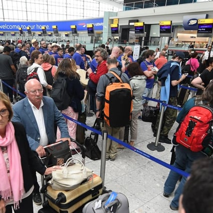 British Airways passengers wait at the baggage drop at Heathrow Airport in London on Monday, the third day of delays following a IT meltdown that disrupted 75,000 passengers’ flights worldwide. Photo: EPA
