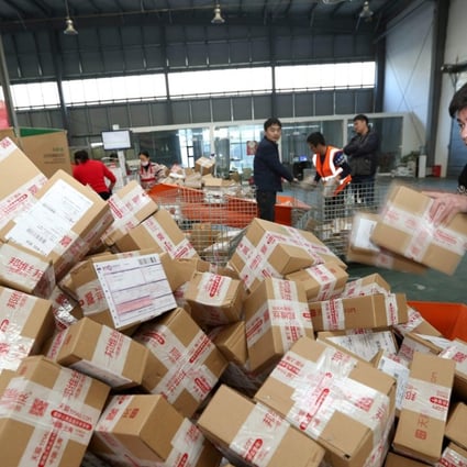 The courier industry is thriving thanks to a nationwide embrace of e-commerce. Some 31.2 billion parcels were delivered across the nation in 2016. Photo: AFP