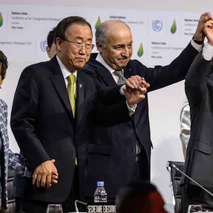 Executive secretary of the UN Framework Convention on Climate Change, Christiana Figueres, then UN secretary-general Ban Ki-moon, French foreign minister Laurent Fabius and president Francois Hollande celebrate after the adoption of the final agreement at the World Climate Change Conference near Paris on December 12, 2015. Photo: EPA