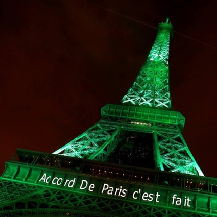 The Eiffel tower illuminated in green with the words "Paris Agreement is Done", to celebrate the Paris U.N. COP21 Climate Change agreement in Paris. Photo: Reuters