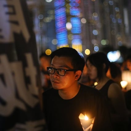 A man pictured attending the vigil in Hong Kong on Sunday to mark the anniversary of the crackdown against pro-democracy demonstrators in Tiananmen Square. Photo: SCMP Pictures