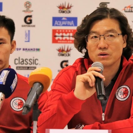 Kim Pan-gon (right) and Hong Kong captain Yapp Hung-fai Photo: HKFA