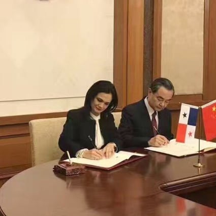 China’s Foreign minister Wang Yi (third left) and his Panama counterpart Isabel Saint Malo sign documents in Beijing establishing formal diplomatic relations between their two nations. Photo: Handout