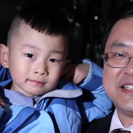 He Liesheng and his son He Yide in Beijing in February 2012. Photo: Simon Song