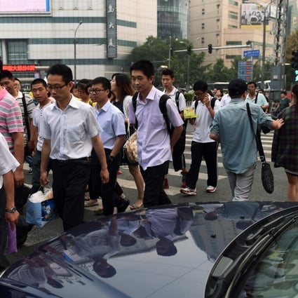 A file picture of pedestrians crossing legally on a green light in Beijing. Photo: AFP