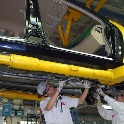 Chinese workers assemble a car at a Honda plant in the southern Chinese city of Guangzhou. Photo: Reuters
