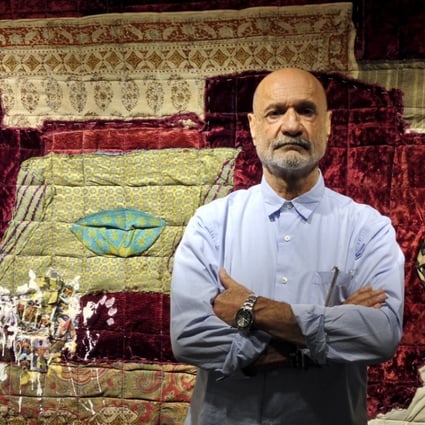 Iranian artist Fereydoun Ave poses with ‘Lahaf 17’, made with a traditional Persian blanket and a patchwork of fabrics including a velvet seat covering from his late grandmother's house. Photo: Enid Tsui