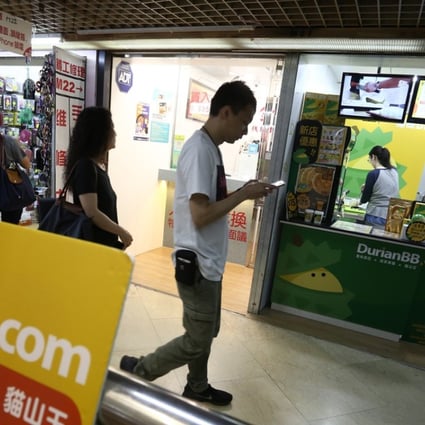 Telecom Digital paid HK$30 million for this Kwun Tong shop lot that’s been subdivided into two stores, the first selling durian desserts, and the other a money changer. Photo: Jonathan Wong