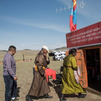 People in traditional dress arrive to vote in the Mongolian presidential election. Photo: AFP