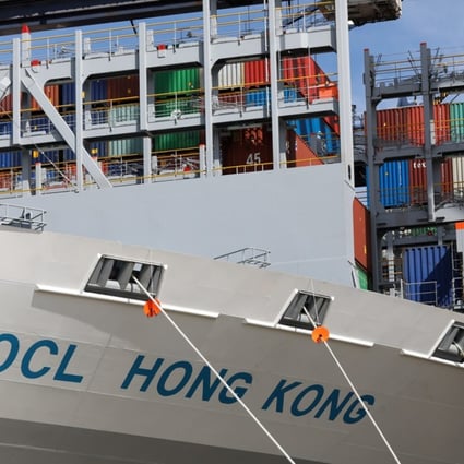 The Orient Overseas Container Line's Hong Kong container ship sits anchored dockside in the British port of Felixstowe on Friday. Photo: Bloomberg