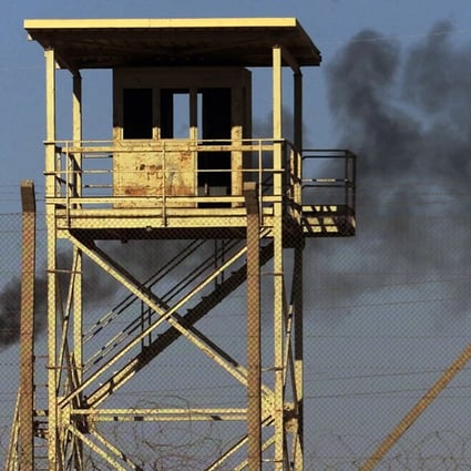 Smoke rises from a petroleum gas flare at Iraq’s largest oil refinery in this 2003 file photo. Years of violent conflict and neglect have devastated the country’s power infrastructure. Photo: AP