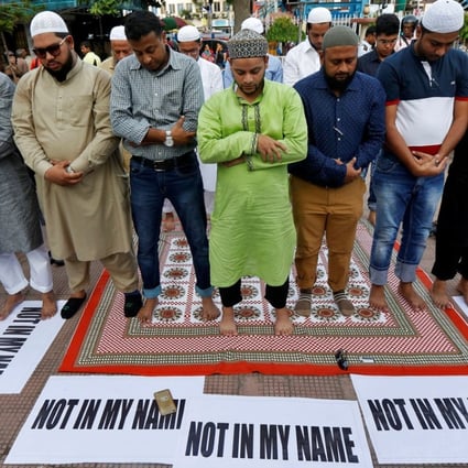 Muslims offer prayers in Kolkata as they take part in a protest against mob lynchings of Muslims who were accused of possessing beef. Photo: Reuters