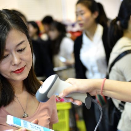 A customer pays with Alipay at a department store in Singapore. Photo: Xinhua