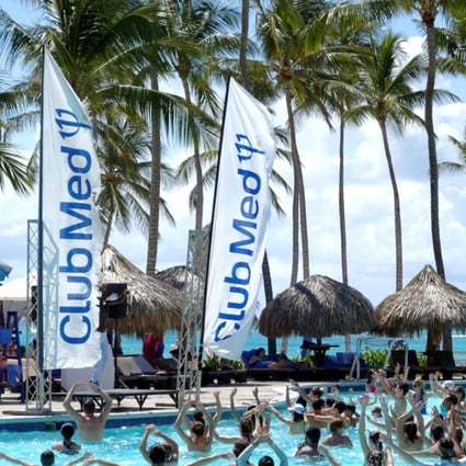 FILE PHOTO: Club Med banners blow in the wind beside the swimming pool at the Club Med Punta Cana vacation resort in the Dominican Republic, March 3, 2016. REUTERS/Charles Platiau/File Photo